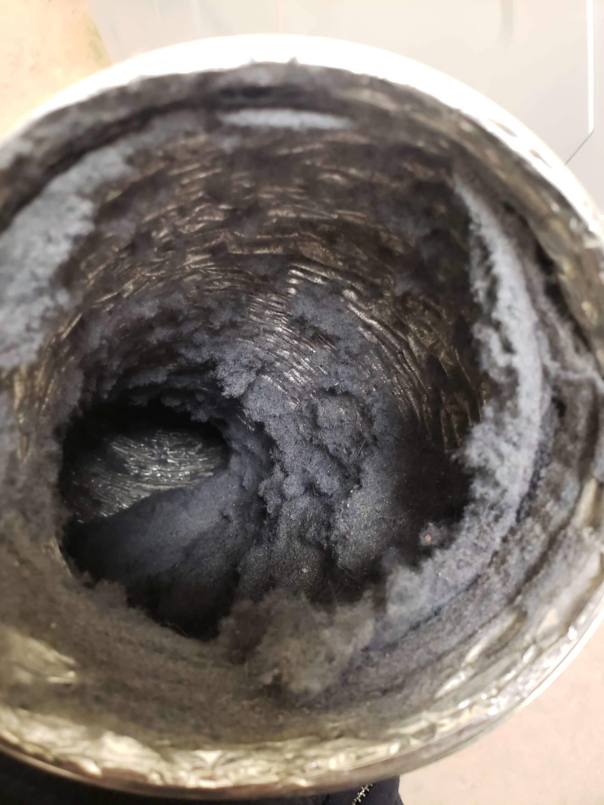 air duct filled with lint